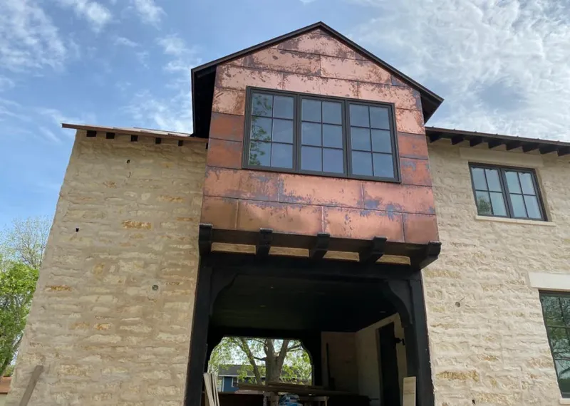 Copper metal panel facade on a stone building for Metal Roof Coating in Provo