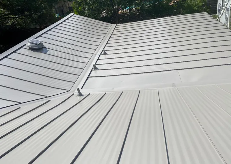 Solar attic fan installed on a metal roof for Roof Ventilation in Provo